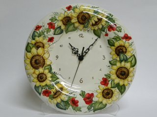 (CODICE ARTICOLO: OR/07) Orologio dipinto a mano con girasoli.Tecnica:maiolica